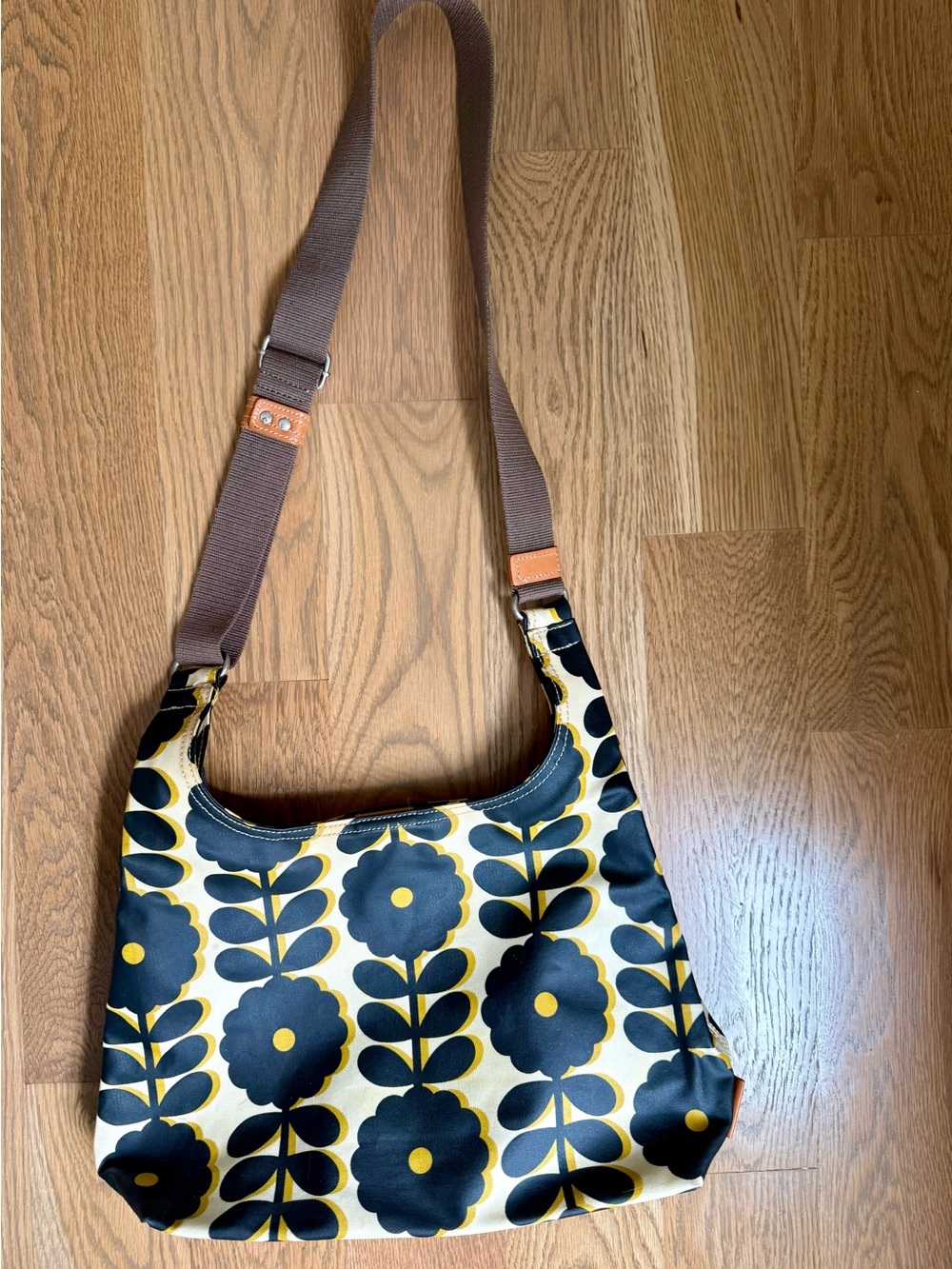 Orla Keily Canvas Floral Crossbody Bag in Black and Gold with Leather Trim